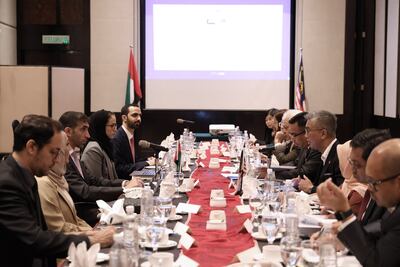 Dr Thani Al Zeyoudi, UAE Minister of State for Foreign Trade, centre left, and Malaysia's Minister of Investment, Trade and Industry, Tengku Zafrul Aziz, centre right, discussing their countries' Cepa progress in June. Photo: Wam