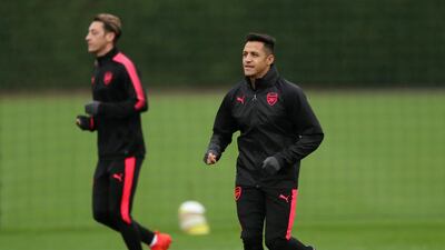 Alexis Sanchez, right, and Mesut Ozil are fit and raring to go. Peter Cziborra / Reuters