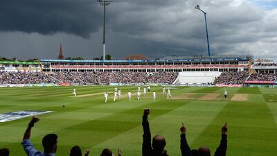 Steven Finn celebrates bowling Australian captain Michael Clarke. Gareth Copley / Getty Images