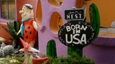 A statue of Fred Flintstone stands near the front entryway of the contentious Flintstone House in Hillsborough, California. AP