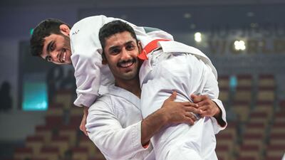 Khaled Al Shehhi, bottom, celebrates with UAE teammate Omar Al Fadhi after their gold medal match, won by Al Shehhi. Victor Besa / The National