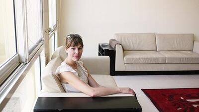 After weeks of searching for a flat, Brad Reagan and his wife, Alison, above, decided on a place for Dh100,000 per year.