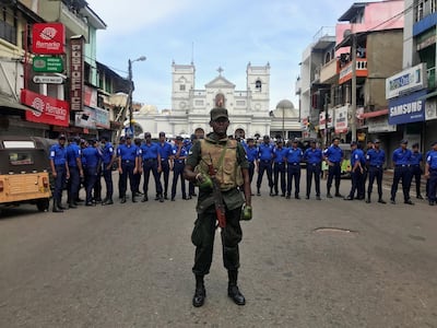 Sri Lankan military officials stand guard in front of the St Anthony's Church. Reuters