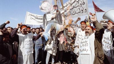 Pro-Iranian Hezbollah protesters burn an effigy of Rushdie in Beirut, Lebanon. AFP