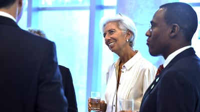Managing director of the International Monetary Fund (IMF) Christine Lagarde, centre, talks with other attendants to the dinner of Finance Ministers of G20. EPA