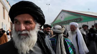 Delegates take a break during a four-day long loya jirga, a meeting of over 2,000 Afghan tribal elders and leaders in Kabul.