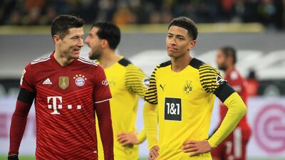 Bayern Munich's Robert Lewandowski and Borussia Dortmund's Jude Bellingham. Reuters