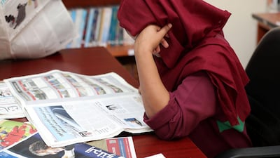 A prisoner keeps up with the latest news. Chris Whiteoak/The National