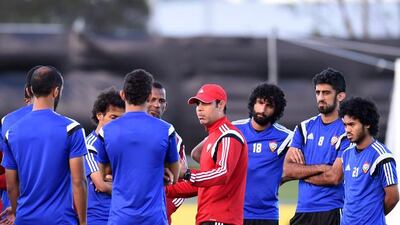 Coach Mahdi Ali, centre, talks to his squad.