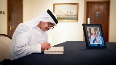 Sheikh Abdullah bin Zayed signs the book of condolence during a visit to the UK embassy in Abu Dhabi. Wam