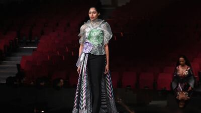 Floor-length gown with tulle embellishment by designer Amit Aggarwal.