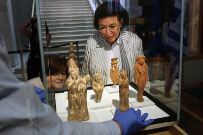 Culture Minister Lina Mendoni handed over the figurines to Egypt’s ambassador to Greece. EPA
