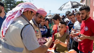 Team members with local Syrians affected by the earthquake