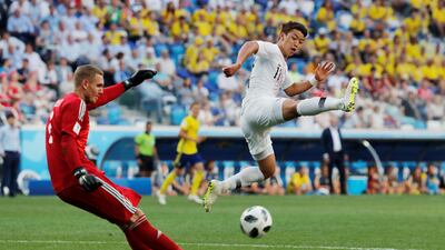 Sweden goalkeeper Robin Olsen makes a clearance. Carlos Barria / Reuters