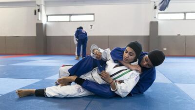 Wadima Al Yafei, in white, is looking to add to her bronze medal won at the 2016 Asian Beach Games when she represents the UAE in jiu-jtsu at the 2018 Asian Games in Indonesia. Reem Mohammed / The National