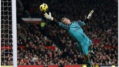 Wojciech Szczesny pulled off a string of fine saves on his Arsenal debut against Manchester United.