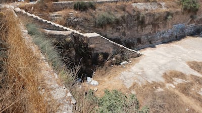 A staircase descends into the now empty Mamilla pool. Photo: Wikipedia