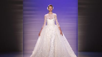 A model wears a wedding dress, the final presentation in the show, from the Haute Couture autumn/winter 2014-2015 collection by Lebanese designer Georges Hobeika at Paris Fashion Week on July 7. Courtesy Etienne Laurent / EPA