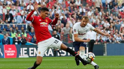 Harry Kane's Tottenham Hotspur, right, were beaten by Chris Smalling's Manchester United in the FA Cup semi-finals. David Klein / Reuters