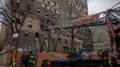 Emergency personnel at the scene of the fatal fire in the Bronx. AP