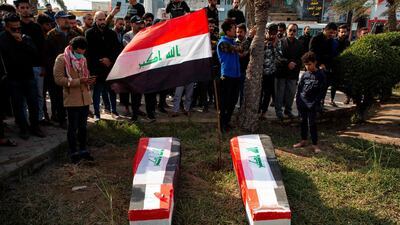 Iraqis carry mock coffins as they take part in a rally to mourn Ahmad Abdessamad, a correspondent for local television station Al-Dijla, and his cameraman Safaa Ghali were shot dead late Friday in Basra. AFP