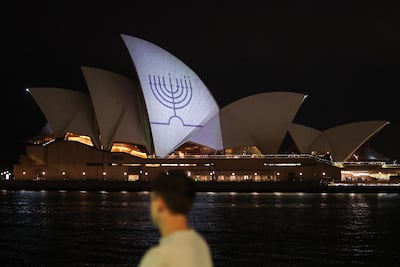 A Hanukkah menorah is projected on to the sails of Sydney Opera House. AFP