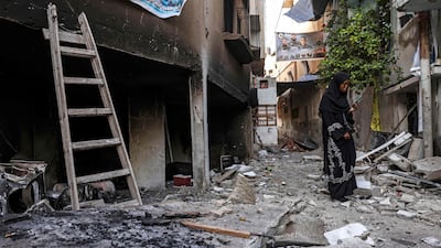 A woman stands in the rubble after an Israeli military operation in Jenin. AFP