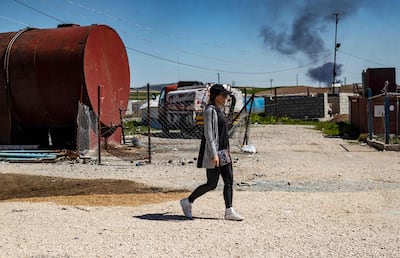 Emilie Konig walks in Camp Al Roj, northeastern Syria, on March 28, 2021, where she was held with others suspected relatives of ISIS members. Konig, one of a number of French jihadists, was repatriated from Syria on July 5. AFP
