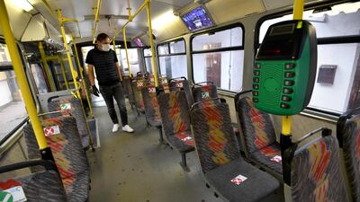 A driver checks social distancing markers on the seats of his tram, before leaving the garage in Sarajevo, Bosia. AFP