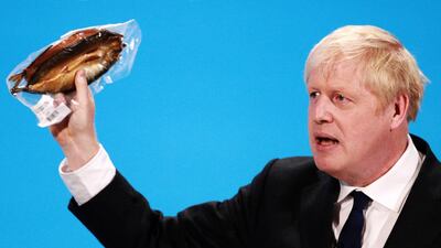 Boris Johnson holds a kipper to help illustrate a point at the Conservative leadership campaign in 2019. Getty Images