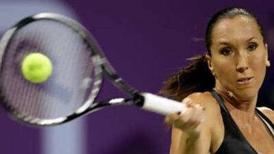 Jelena Jankovic returns a forehand to her compatriot Ana Ivanovic.