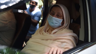 Saira Banu, wife of Indian actor Dilip Kumar, sits in a car as she leaves her residence for his funeral after he died at the age of 98 in Mumbai on July 7, 2021.