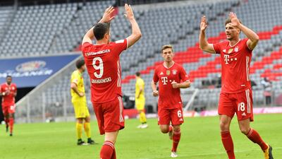 Bayern Munich's Robert Lewandowski Leon Goretzka celebrate a goal. AFP