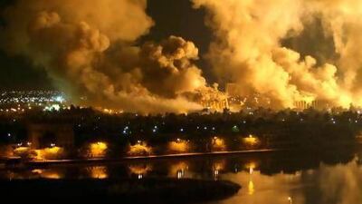 Smoke covers the presidential palace compound in Baghdad in March, 2003 during a massive US-led air raid on the Iraqi capital.