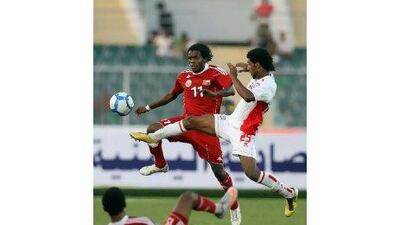 Oman’s Saeed al Mreighi, left, vies for the ball with UAE’s Maher Galoum in Aden yesterday.