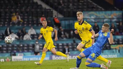 Artem Dovbyk, right, of Ukraine scores his team's second goal during the Uefa Euro 2020 last-16 match against Sweden in Glasgow, Scotland, on June 29. EPA / Petr Josek