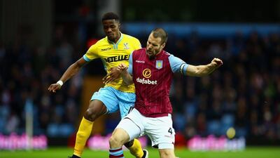 Wilfried Zaha of Crystal Palace and Ron Vlaar of Aston Villa battle for the ball during their goalless draw in the Premier League on Thursday at Villa Park. Richard Heathcote / Getty Images