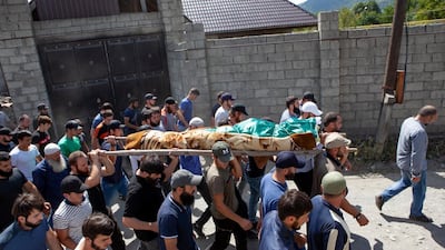 The funeral of Zelimkhan Khangoshvili in Georgia after his killing in Berlin that has been linked to the Russian state. AP