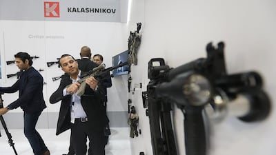 Visitors at the Kalashnikov stand. The world’s most famous assault rifle could be made in the UAE under plans being considered by its owner. Satish Kumar / The National