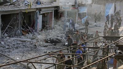 Turkey-backed Syrian fighters inspect the site of the explosion. AFP