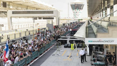Fans walk through the pit lane during previews for the Abu Dhabi Formula One Grand Prix at Yas Marina Circuit in Abu Dhabi on November 23, 2017. Christopher Pike / The National