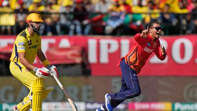 Punjab Kings' Rahul Chahar, right, celebrates the wicket of Chennai Super Kings captain Ruturaj Gaikwad, caught by Jitesh Sharma, for 32. AP