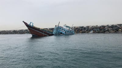 Seven sailors were rescued after their stricken vessel capsized during fierce weather conditions in Dubai on Sunday.