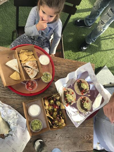 Helen Farmer's daughter Phoebe eating from the newly launched children's menu at Taqado. Courtesy The Mothership DXB