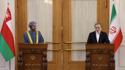 Iran's Foreign Minister Abbas Araghchi, right, and Oman's Foreign Minister Sayyid Badr Al Busaidi give a joint press conference in Tehran on December 30. AFP