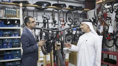 Sam Sayadan, left, and Khalid Al Zarooni, who gave up motorcycles and founded the Cycle Hub, are leading the way in services to cyclists and championing the sport. Reem Mohammed/ The National