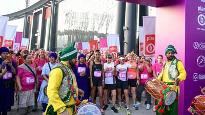 A dhol group performs before the 5km run at the Dubai Women's Run.