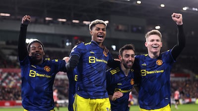 Marcus Rashford of Manchester United celebrates with teammates Anthony Elanga, Bruno Fernandes and Scott McTominay. Getty