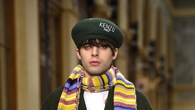 Nigo mixed a Japanese style jacket with a striped scarf at the Men's Paris Fashion Week show.