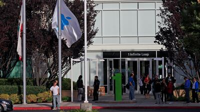 Flags fly at half staff following the death of Steve Jobs at Apple headquarters Wednesday, Oct. 5, 2011 in Cupertino, Calif. Jobs, the Apple founder and former CEO who invented and masterfully marketed ever-sleeker gadgets that transformed everyday techno???